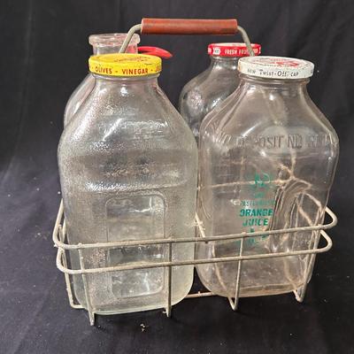 Vintage 1/2 gallon bottles (4) and carrying cage