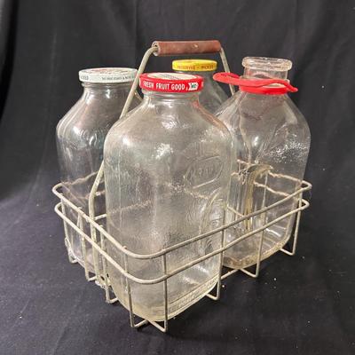 Vintage 1/2 gallon bottles (4) and carrying cage