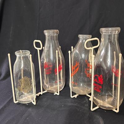 4 Vintage milk bottles with cage