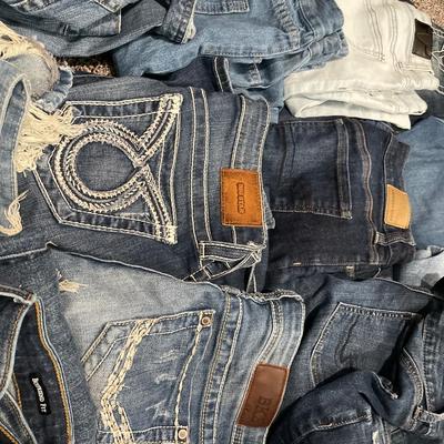 Tote of denim jeans and 1 jacket