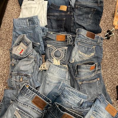 Tote of denim jeans and 1 jacket