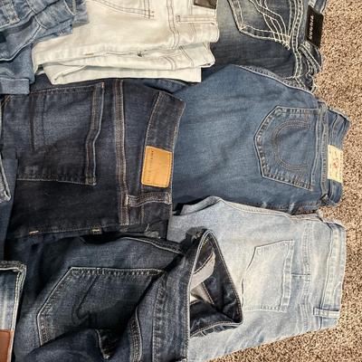 Tote of denim jeans and 1 jacket