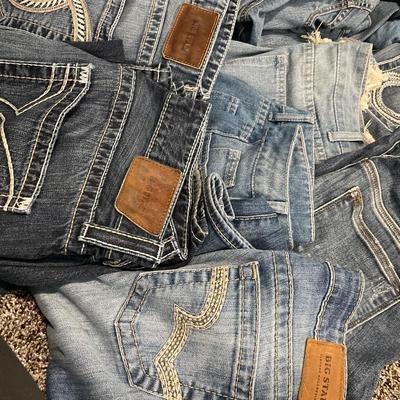 Tote of denim jeans and 1 jacket