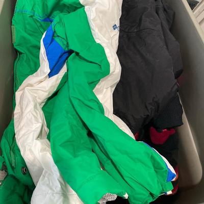 Tote of snowpants and Columbia jacket