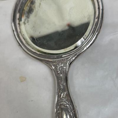 Sale Photo Thumbnail #56: In fair condition - there are dings and dents, and some deterioration of nail buffer pad, mirror clarity which is normal for the age of the pieces.. See photos for condition. All pieces are marked Sterling except for jar lid, but it looks like the other p
