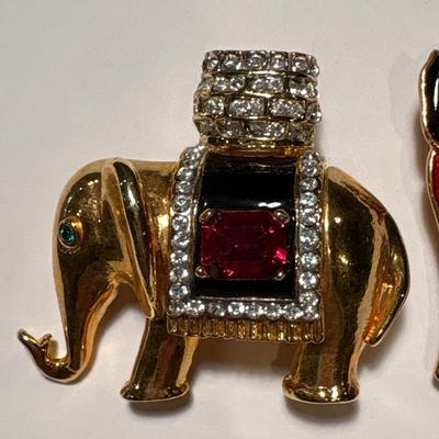 Two elephant brooches