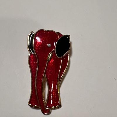 Two elephant brooches