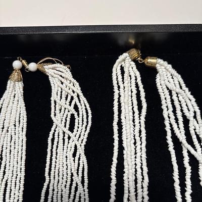 Two beaded white necklaces