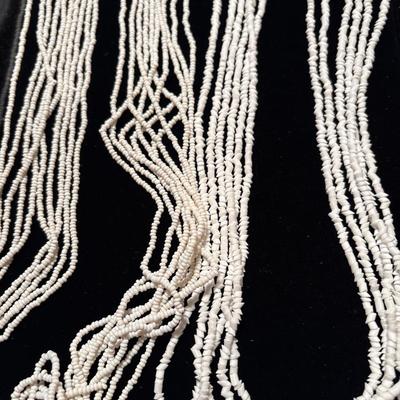 Two beaded white necklaces