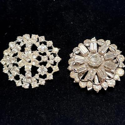 Two rhinestone brooches