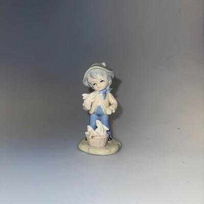 Porcelain Figurine Boy w/ rabbits
