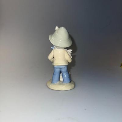 Porcelain Figurine Boy w/ rabbits