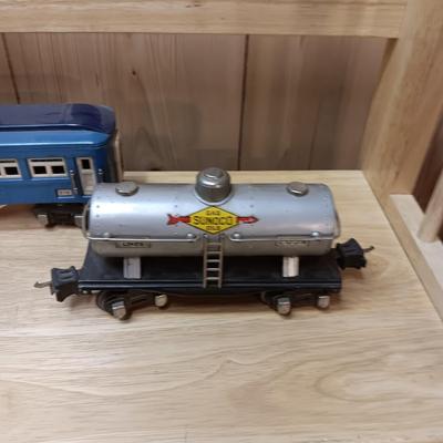 LIONEL BLUE COMET PASSENGER TRAIN, SUNOCO TANK CAR, A BOXCAR, RAILROAD LIGHT AND NO CROSSING
