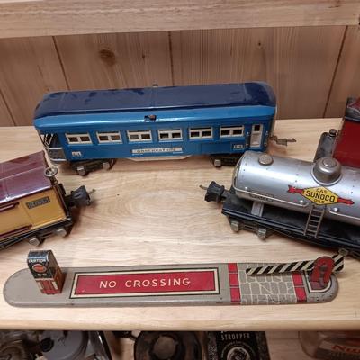 LIONEL BLUE COMET PASSENGER TRAIN, SUNOCO TANK CAR, A BOXCAR, RAILROAD LIGHT AND NO CROSSING
