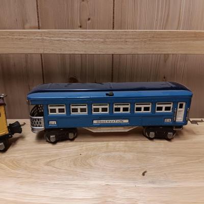 LIONEL BLUE COMET PASSENGER TRAIN, SUNOCO TANK CAR, A BOXCAR, RAILROAD LIGHT AND NO CROSSING