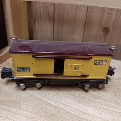 LIONEL BLUE COMET PASSENGER TRAIN, SUNOCO TANK CAR, A BOXCAR, RAILROAD LIGHT AND NO CROSSING