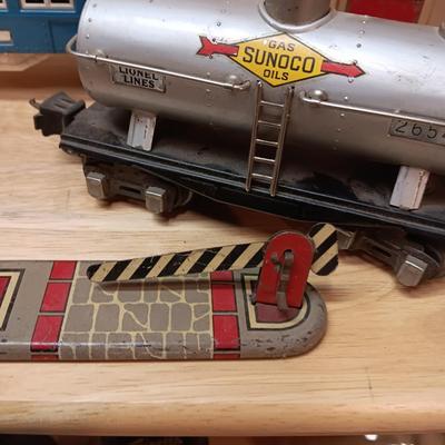 LIONEL BLUE COMET PASSENGER TRAIN, SUNOCO TANK CAR, A BOXCAR, RAILROAD LIGHT AND NO CROSSING