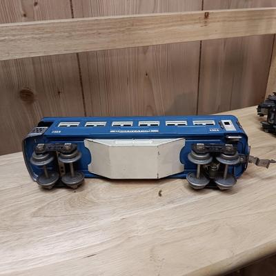 LIONEL BLUE COMET PASSENGER TRAIN, SUNOCO TANK CAR, A BOXCAR, RAILROAD LIGHT AND NO CROSSING