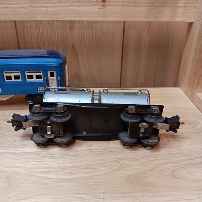 LIONEL BLUE COMET PASSENGER TRAIN, SUNOCO TANK CAR, A BOXCAR, RAILROAD LIGHT AND NO CROSSING