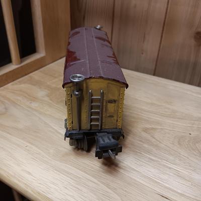 LIONEL BLUE COMET PASSENGER TRAIN, SUNOCO TANK CAR, A BOXCAR, RAILROAD LIGHT AND NO CROSSING