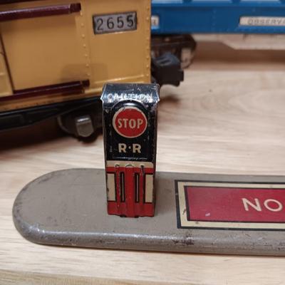 LIONEL BLUE COMET PASSENGER TRAIN, SUNOCO TANK CAR, A BOXCAR, RAILROAD LIGHT AND NO CROSSING