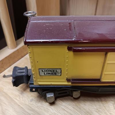 LIONEL BLUE COMET PASSENGER TRAIN, SUNOCO TANK CAR, A BOXCAR, RAILROAD LIGHT AND NO CROSSING