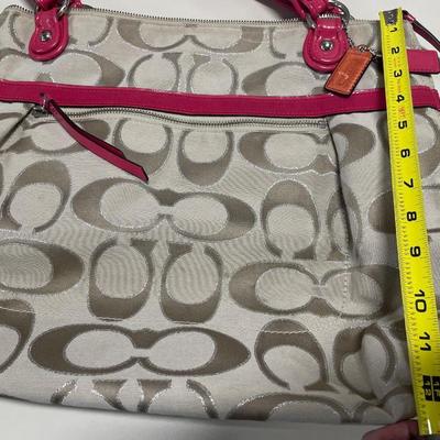 Red and cream Coach purse