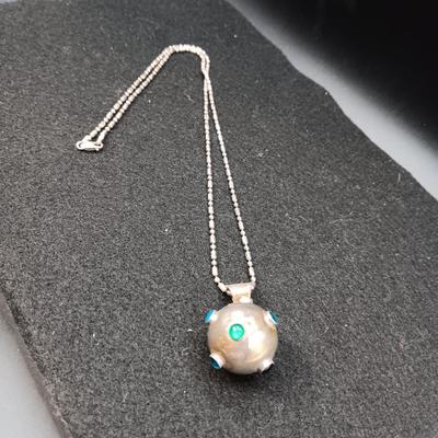 VERY UNIQUE NATIVE MADE STERLING SILVER ENCLOSED BELL ON A STERLING CHAIN