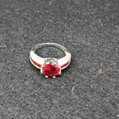 STERLING EARRINGS AND RING (SIZE 6 1/2) WITH RED STONES