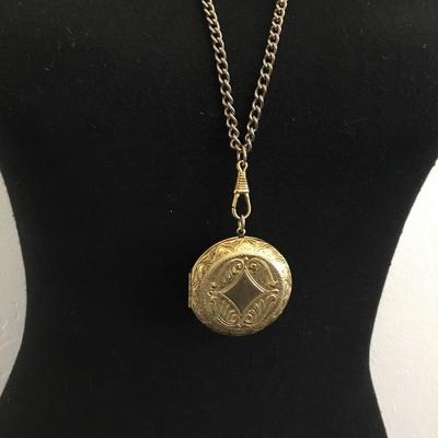 Vintage, circular gold tone, locket on chain necklace