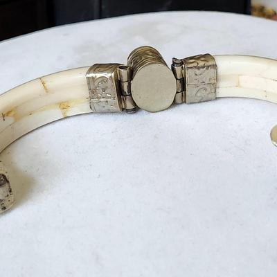 Sale Photo Thumbnail #375: Creamy white brown bone with repousse silver bindings.
Lovely vintage piece.