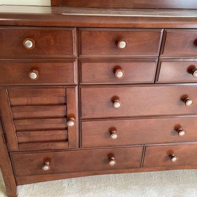 Sale Photo Thumbnail #135: Dark wood. In great Condition. 6 Drawers and 2 side openings. Mirror included. Matches LOT 23 and 25. Measures 64L x 18W x 41.5H. Mirror Measures 40L x 44H.