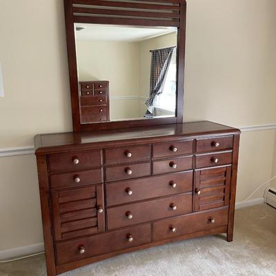 Sale Photo Thumbnail #133: Dark wood. In great Condition. 6 Drawers and 2 side openings. Mirror included. Matches LOT 23 and 25. Measures 64L x 18W x 41.5H. Mirror Measures 40L x 44H.