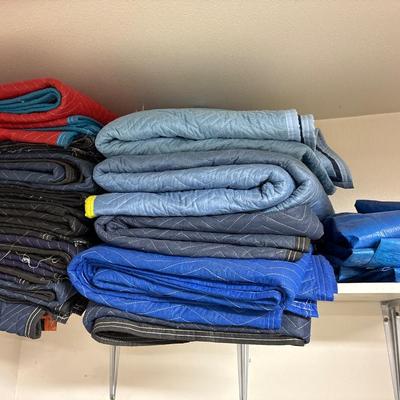 Large group of moving blankets and tarps