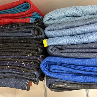 Large group of moving blankets and tarps