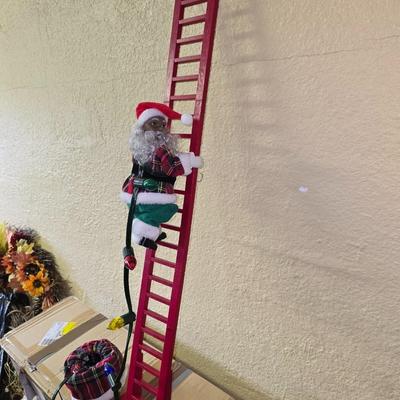 Ladder climbing santy claws