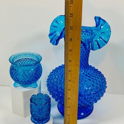 LOT 6: Collection of Blue Glass Vases Featuring Fenton Colonial Blue Hobnail Ruffle Top Vase and More