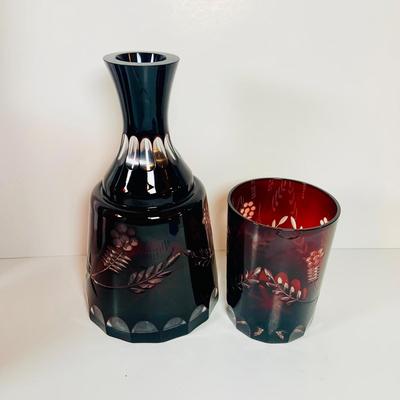 Lot 9: Bohemian Czech Amethyst Cut Glass Decanter and Tumbler and Red Art Glass Vases