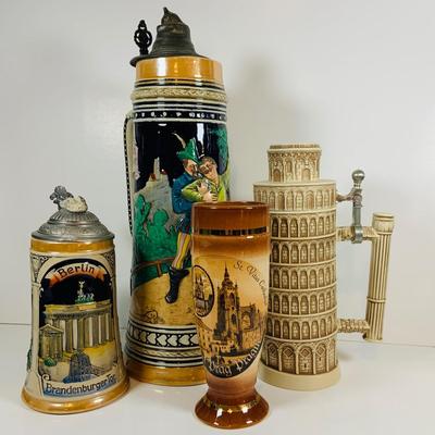 LOT 20: Collection of Beer Steins Including Berlin Wall Stein with a Piece of the Wall on The Lid