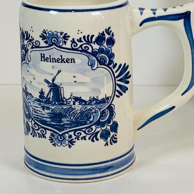 LOT 21: Assortment of Ceramic Mugs, Steins, and Bottles Featuring a Blue Delft Heineken Mug