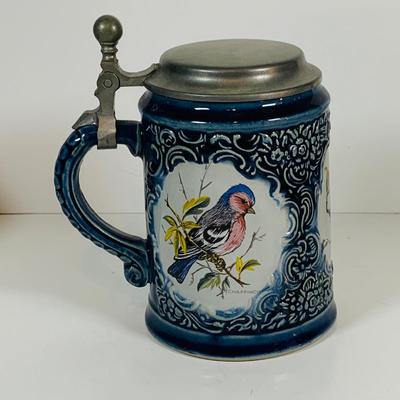 LOT 21: Assortment of Ceramic Mugs, Steins, and Bottles Featuring a Blue Delft Heineken Mug