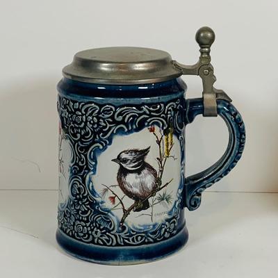 LOT 21: Assortment of Ceramic Mugs, Steins, and Bottles Featuring a Blue Delft Heineken Mug