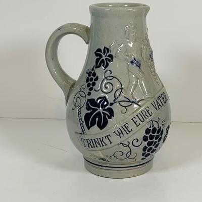 LOT 21: Assortment of Ceramic Mugs, Steins, and Bottles Featuring a Blue Delft Heineken Mug