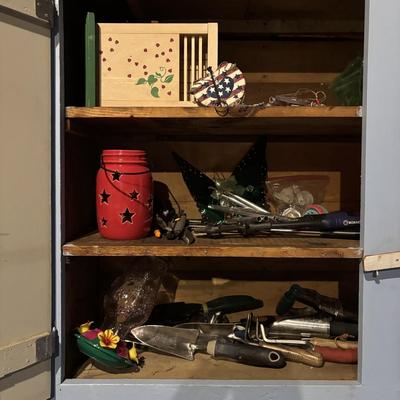 LOT 104: Garage Garden Supplies and More Cabinet Cleanout