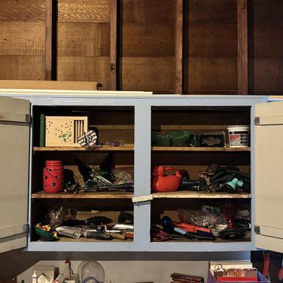 LOT 104: Garage Garden Supplies and More Cabinet Cleanout