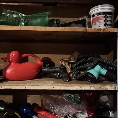LOT 104: Garage Garden Supplies and More Cabinet Cleanout