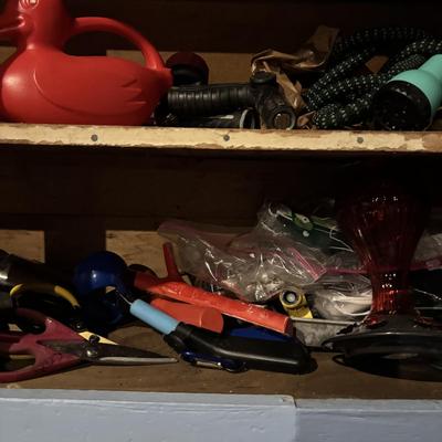 LOT 104: Garage Garden Supplies and More Cabinet Cleanout