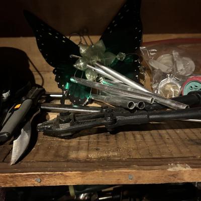 LOT 104: Garage Garden Supplies and More Cabinet Cleanout