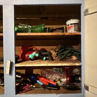 LOT 104: Garage Garden Supplies and More Cabinet Cleanout