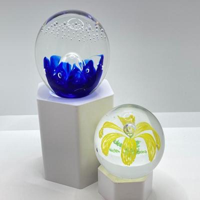 LOT 164: Pair of Glass Paperweights - Yellow Flower and Blue Abstract